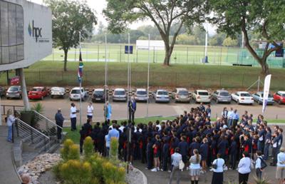 TuksSport learners raise the flag to welcome the Argentinean Soccer Team